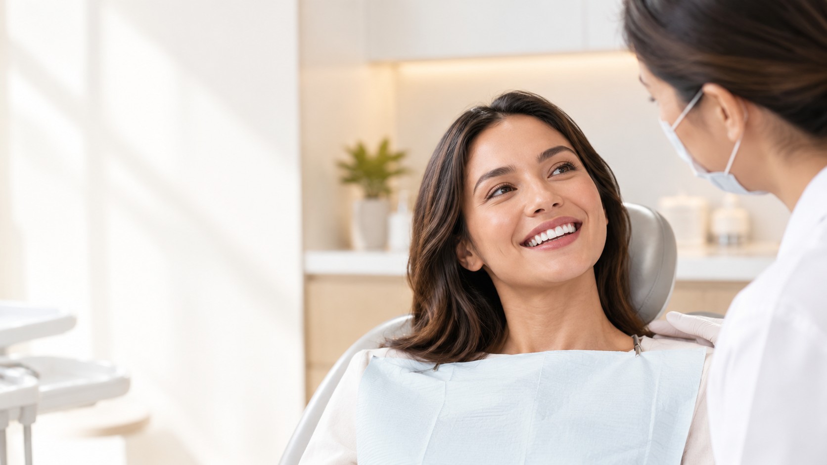 Smiling woman reclining in a dental chair during a preventive dental examination in Sandy Springs, GA