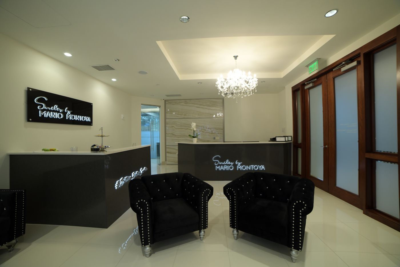 Interior reception area at Smiles by Mario Montoya in Sandy Springs, GA, featuring modern furnishings