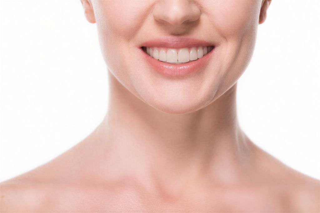 Close-up of a woman's bright, natural-looking smile, highlighting cosmetic dentistry and smile aesthetics
